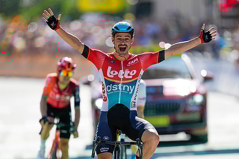 Victor Campenaerts celebrates as he crosses the finish line